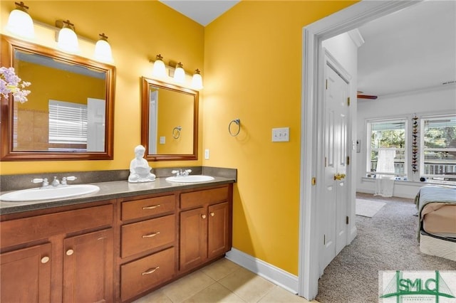 bathroom featuring tile patterned flooring and vanity