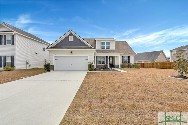 view of front facade featuring a garage and a front yard