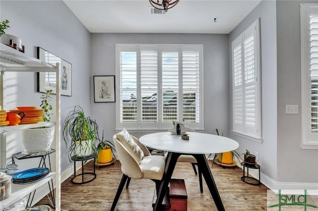 dining room with light wood-type flooring