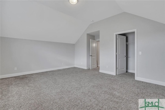 bonus room featuring carpet and vaulted ceiling