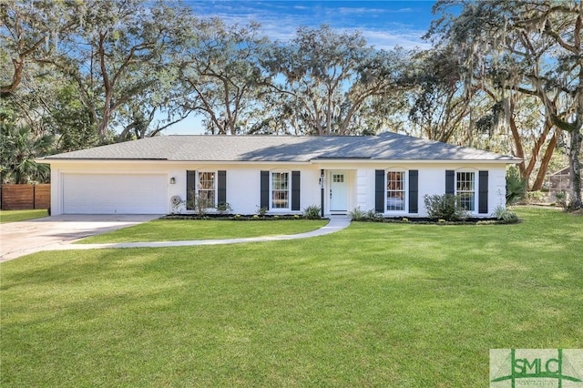 ranch-style home featuring a front yard and a garage