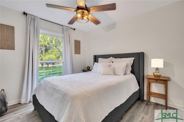 bedroom featuring light hardwood / wood-style flooring and ceiling fan