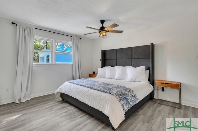 bedroom featuring ceiling fan and light wood-type flooring