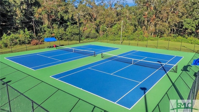 view of tennis court featuring basketball court