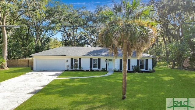 view of front of house featuring a front yard and a garage