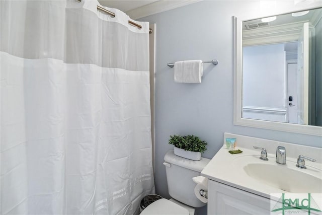 bathroom featuring crown molding, vanity, a shower with shower curtain, and toilet