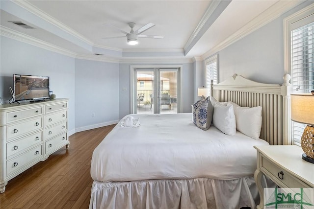 bedroom with access to exterior, ceiling fan, crown molding, a tray ceiling, and hardwood / wood-style flooring