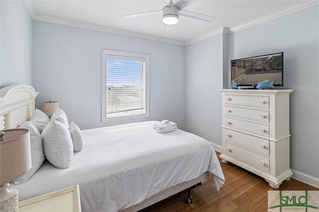 bedroom with ceiling fan, dark hardwood / wood-style flooring, and ornamental molding