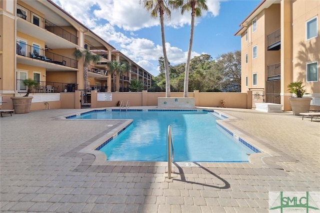 view of swimming pool featuring a patio