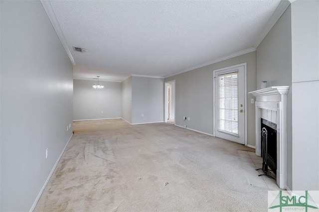 unfurnished living room featuring a notable chandelier, ornamental molding, a textured ceiling, and light carpet