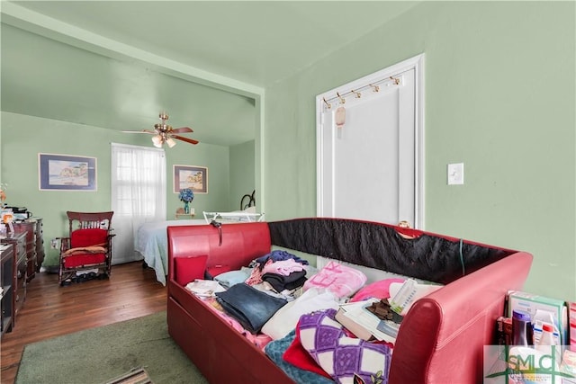 bedroom featuring ceiling fan and dark hardwood / wood-style floors