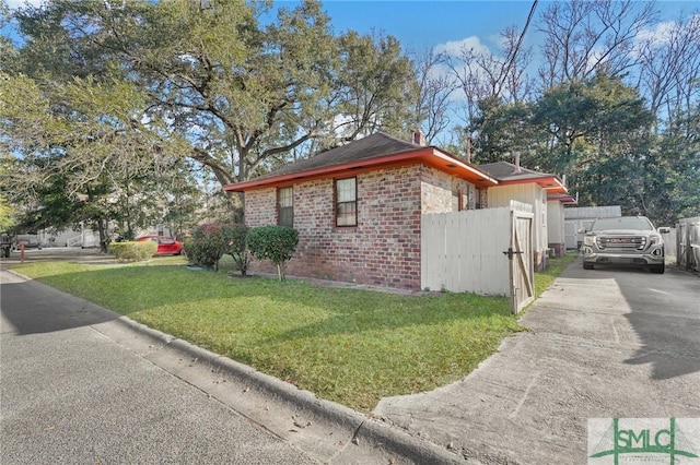 view of home's exterior featuring a yard