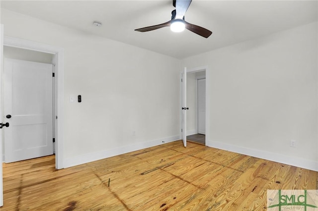 spare room featuring hardwood / wood-style flooring and ceiling fan