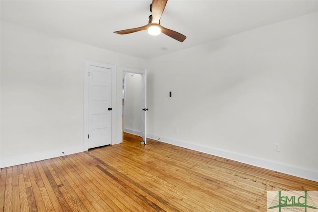 empty room with ceiling fan and wood-type flooring