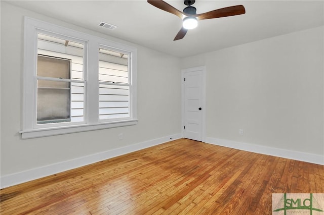 unfurnished room with hardwood / wood-style floors and ceiling fan