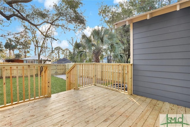 wooden terrace with a yard