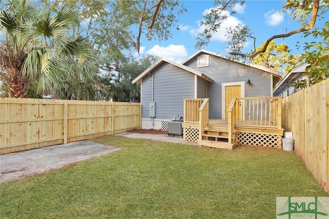 back of property featuring central AC, a patio, a deck, and a lawn