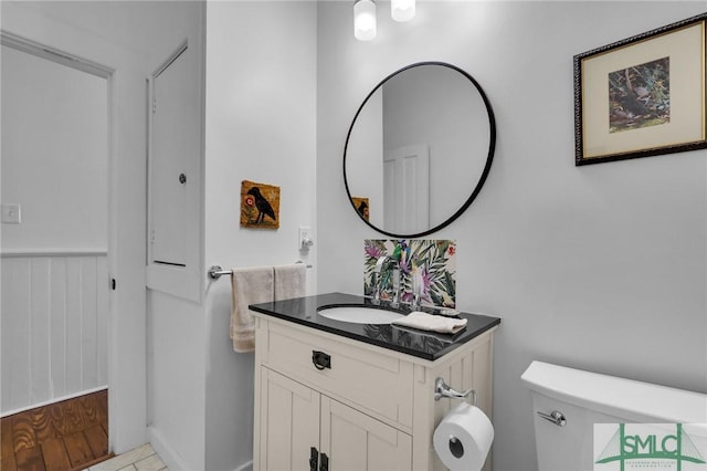 bathroom featuring vanity and toilet