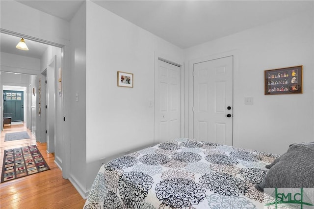 bedroom featuring hardwood / wood-style flooring and a closet