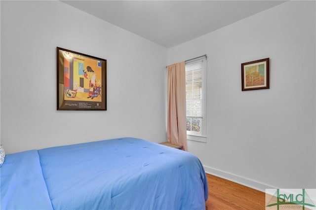 bedroom with wood-type flooring