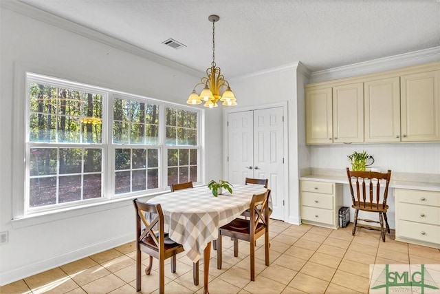 dining room featuring a chandelier, light tile patterned floors, a textured ceiling, and ornamental molding