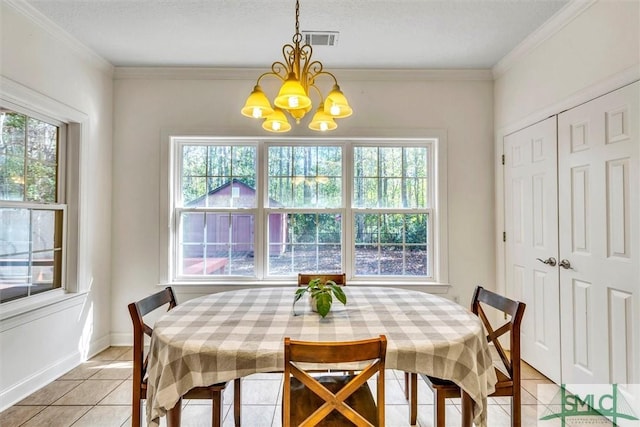 dining room featuring light tile patterned floors, ornamental molding, and a chandelier