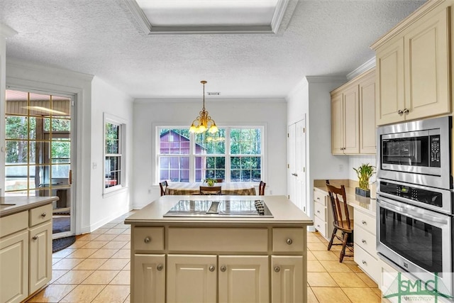 kitchen featuring crown molding, a textured ceiling, appliances with stainless steel finishes, decorative light fixtures, and a chandelier