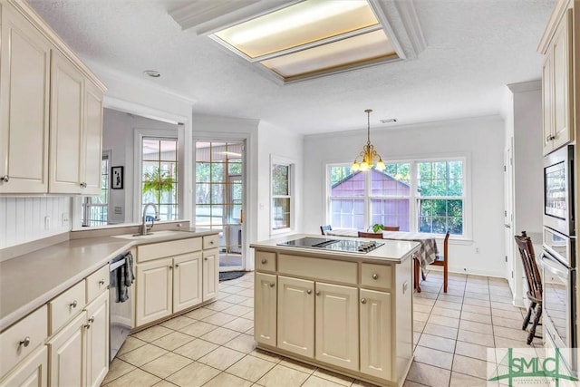 kitchen featuring a textured ceiling, stainless steel appliances, light tile patterned floors, a chandelier, and hanging light fixtures