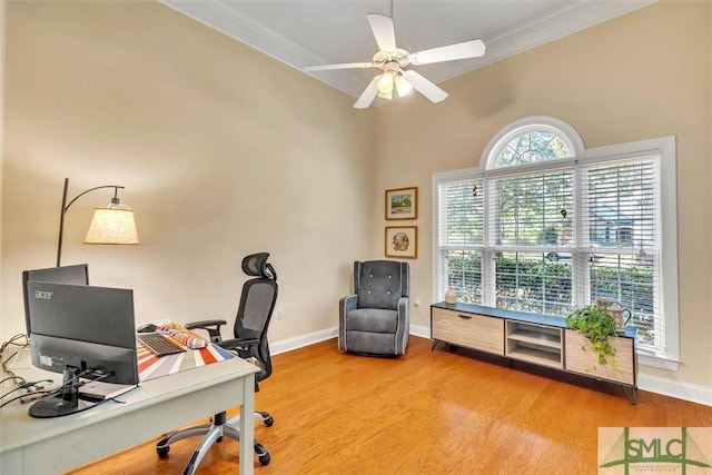 home office featuring hardwood / wood-style flooring, ceiling fan, and crown molding