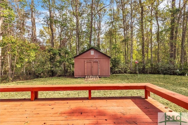 deck featuring a shed and a yard