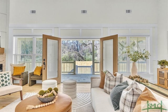 sunroom / solarium with a tiled fireplace