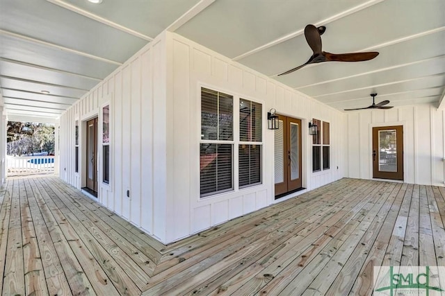 deck with french doors and ceiling fan