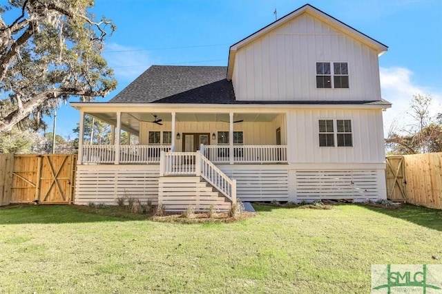 view of front of house with a front yard and covered porch