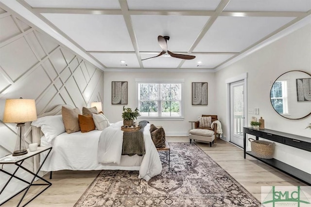 bedroom featuring coffered ceiling, ceiling fan, and light wood-type flooring