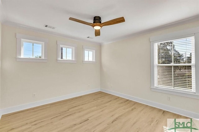 unfurnished room featuring ceiling fan, a healthy amount of sunlight, and light wood-type flooring