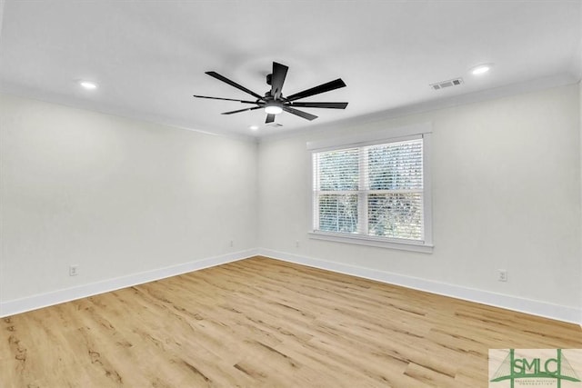 unfurnished room with light hardwood / wood-style floors, ceiling fan, and ornamental molding