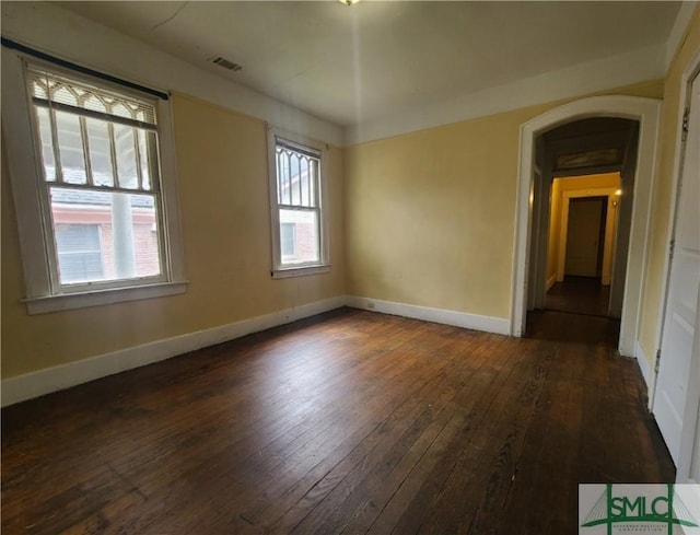 empty room featuring dark wood-type flooring