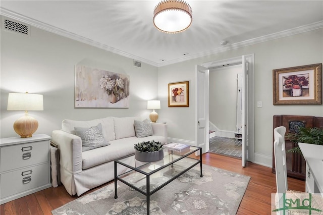 living room featuring crown molding and wood-type flooring