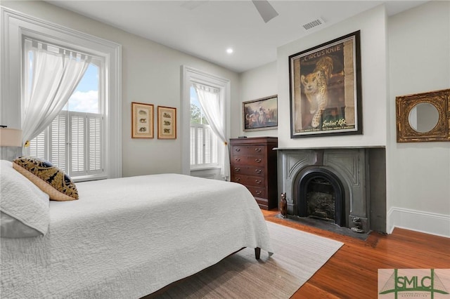 bedroom featuring hardwood / wood-style floors and ceiling fan