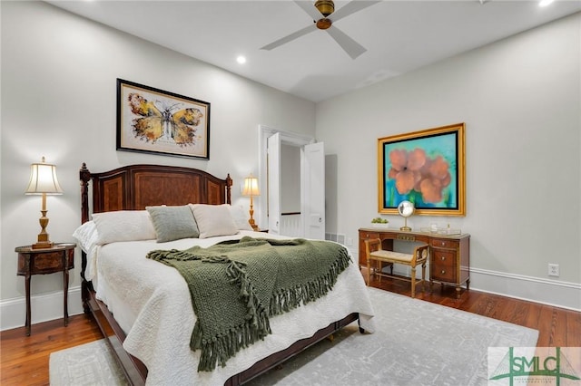 bedroom featuring hardwood / wood-style flooring and ceiling fan