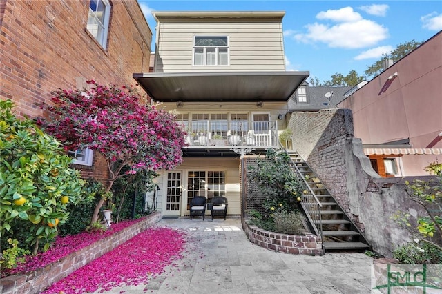 back of house featuring french doors and a patio