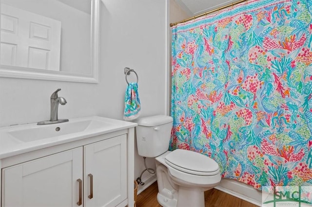 bathroom with a shower with shower curtain, vanity, toilet, and wood-type flooring