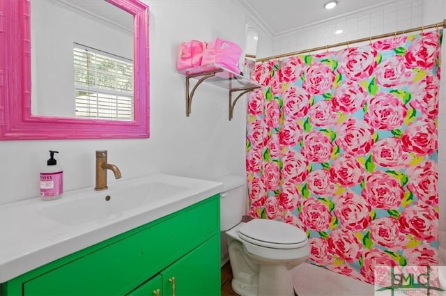 bathroom featuring walk in shower, toilet, vanity, and ornamental molding