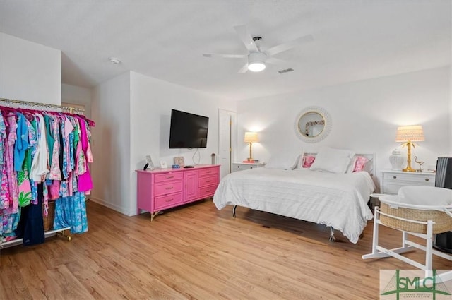 bedroom featuring ceiling fan and light hardwood / wood-style floors