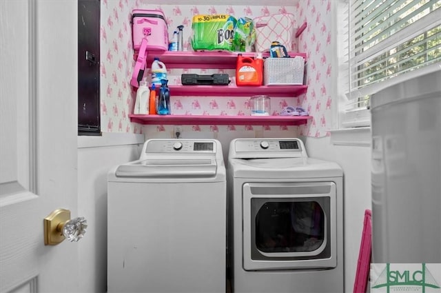 laundry area with independent washer and dryer