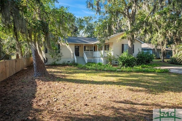 ranch-style home featuring a porch and a front yard