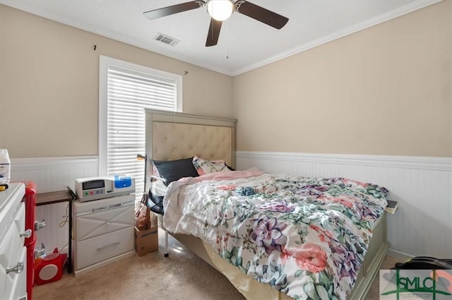 115 Crossing Cir, Rincon, GA 31326 - carpeted bedroom with a wainscoted wall, ornamental molding, and a ceiling fan