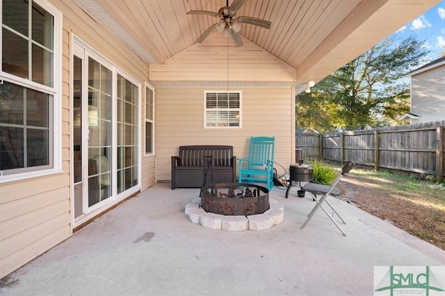 view of patio / terrace with a fire pit and ceiling fan