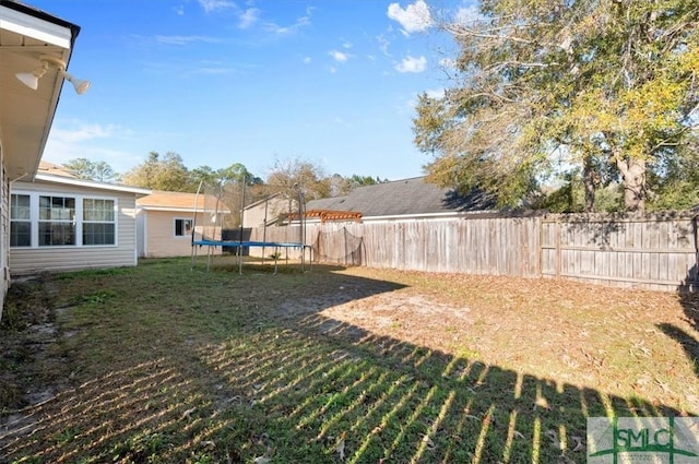 view of yard featuring a trampoline