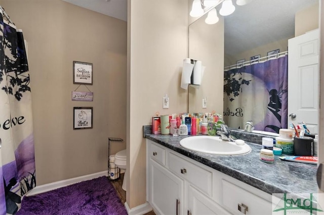 115 Crossing Cir, Rincon, GA 31326 - full bathroom with toilet, vanity, baseboards, and a shower with curtain